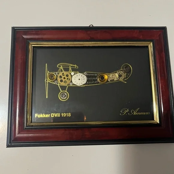 framed piece of art featuring a representation of an airplane with clock pieces - Picture 3 of 10